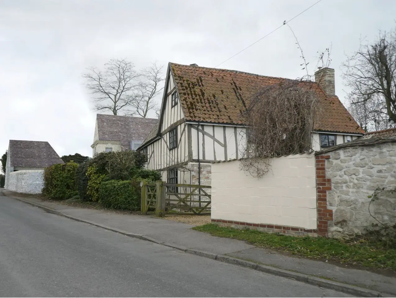 View along the street, with listed building in foreground